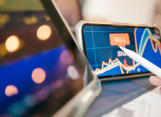 Trader analysing Bitcoin, Ethereum and forex options across multiple markets